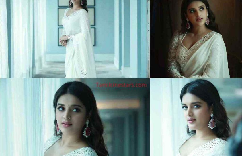 Eeswaran Actress Niddhi Agerwal Sizzling in White Saree Photoshoot Stills